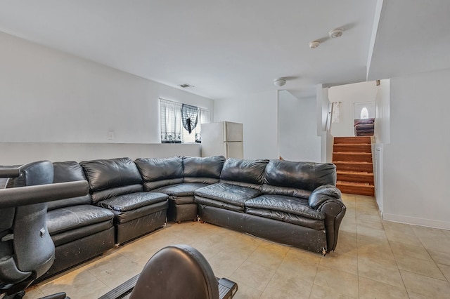 living room with light tile patterned floors