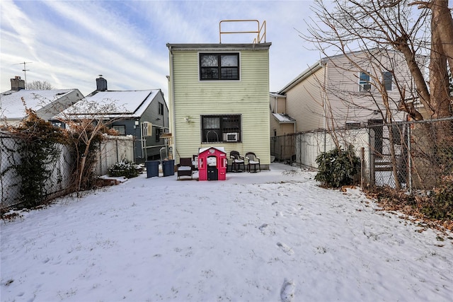 view of snow covered house