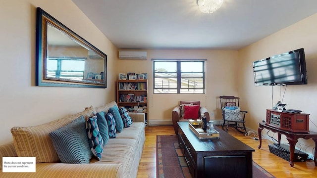 living room with hardwood / wood-style flooring and a wall unit AC