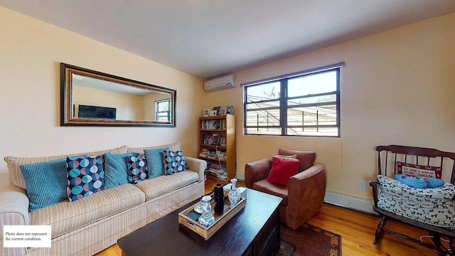 living room with a baseboard radiator, hardwood / wood-style floors, and an AC wall unit