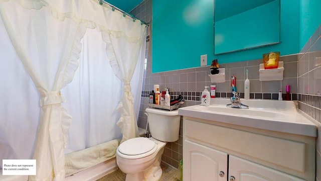 bathroom with vanity, tile walls, a shower with shower curtain, and toilet