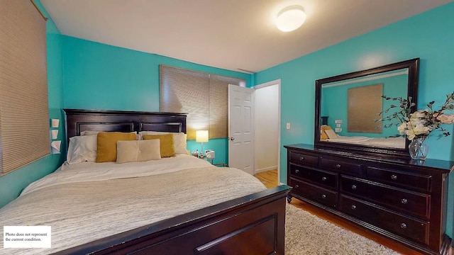 bedroom with wood finished floors