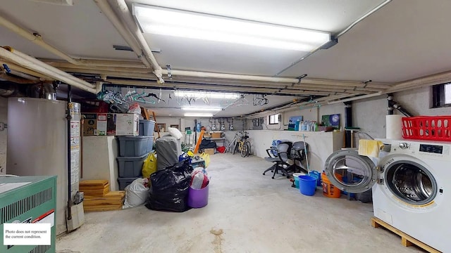 unfinished basement with washer and dryer and water heater