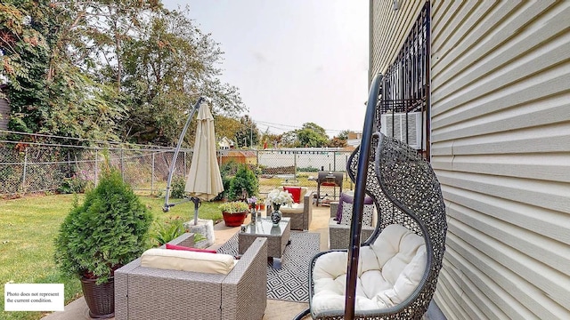 view of patio featuring a fenced backyard and an outdoor hangout area