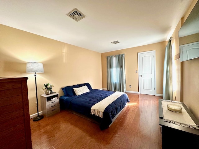 bedroom featuring wood-type flooring