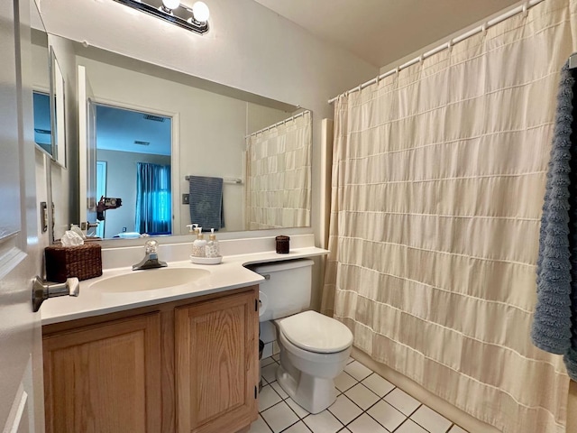 bathroom featuring tile patterned flooring, vanity, curtained shower, and toilet