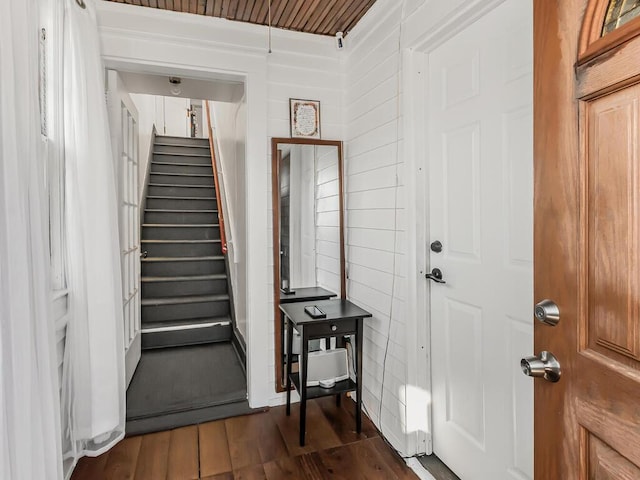 foyer with dark hardwood / wood-style floors