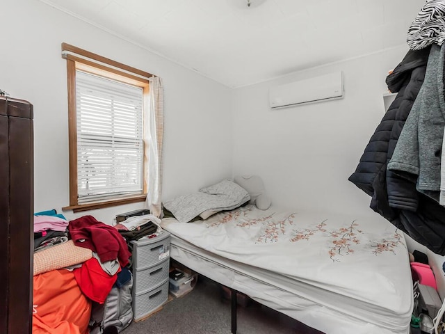 bedroom featuring a wall unit AC