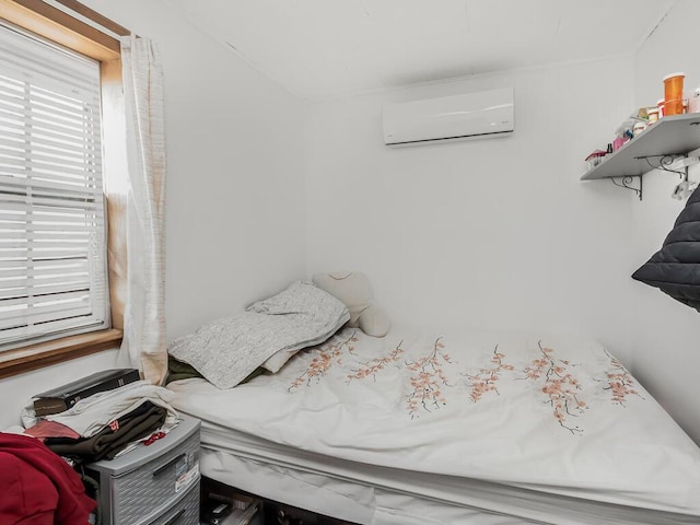 bedroom with a wall unit AC