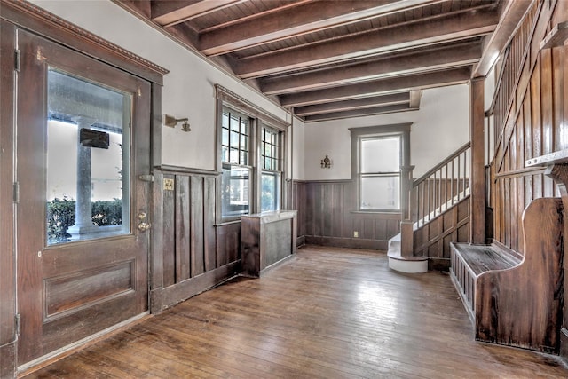 entryway with hardwood / wood-style floors, wood ceiling, and beamed ceiling