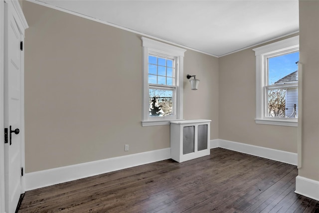 unfurnished room featuring crown molding and dark hardwood / wood-style floors