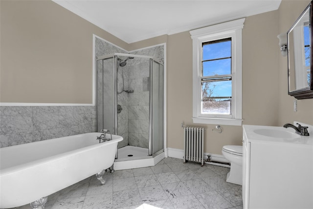 full bathroom featuring vanity, radiator, toilet, and separate shower and tub