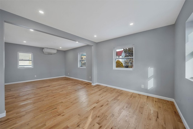 unfurnished room featuring light hardwood / wood-style floors