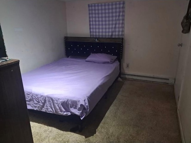 bedroom featuring carpet floors and a baseboard heating unit