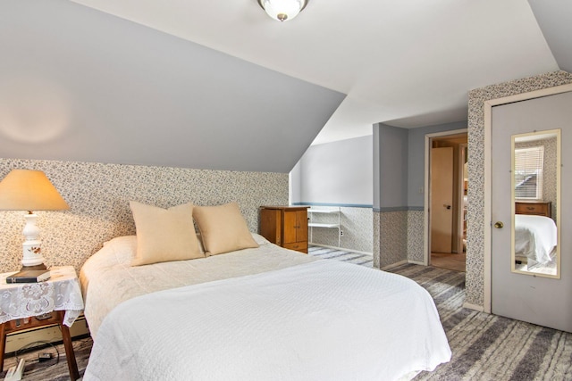 bedroom with lofted ceiling