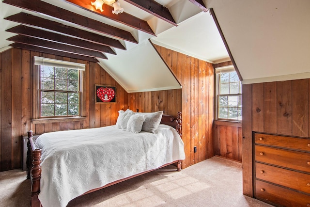 carpeted bedroom with lofted ceiling with beams and wood walls