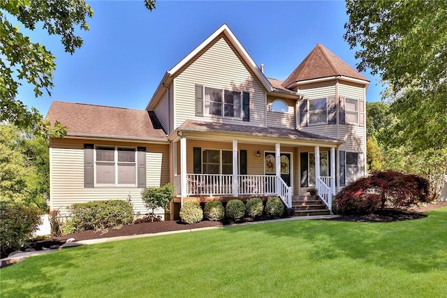 view of front of house featuring a porch and a front yard