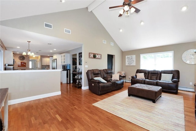 living area with a baseboard heating unit, ceiling fan with notable chandelier, wood finished floors, visible vents, and beam ceiling