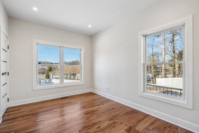 empty room with dark hardwood / wood-style floors