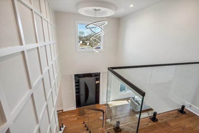 stairs with hardwood / wood-style flooring