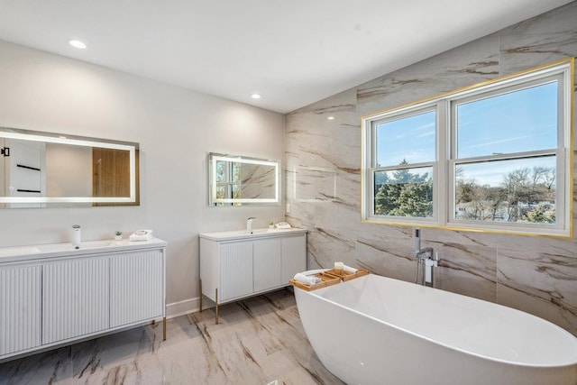 bathroom with vanity and a bathing tub