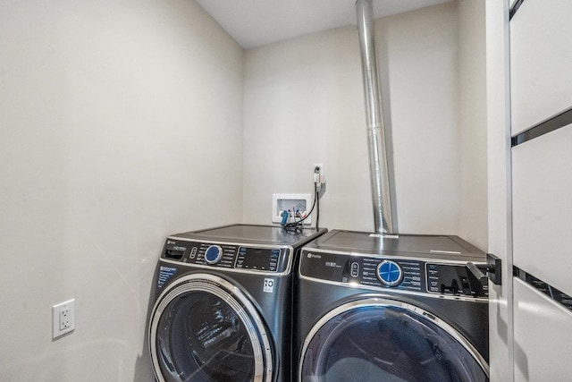 laundry room featuring washing machine and clothes dryer