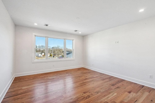 empty room featuring hardwood / wood-style floors