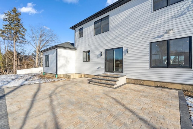 back of property with a patio area