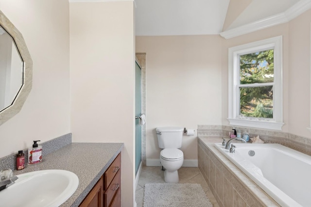 bathroom with a garden tub, a stall shower, tile patterned flooring, and vanity