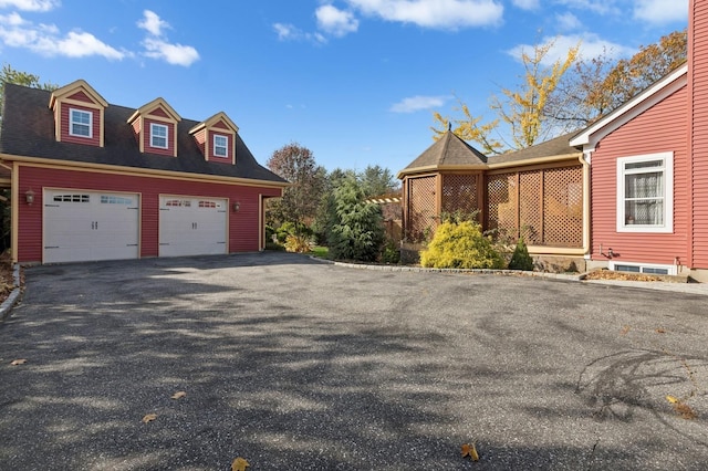 view of property exterior with a garage