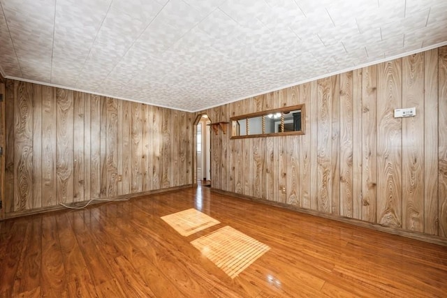 empty room with hardwood / wood-style flooring