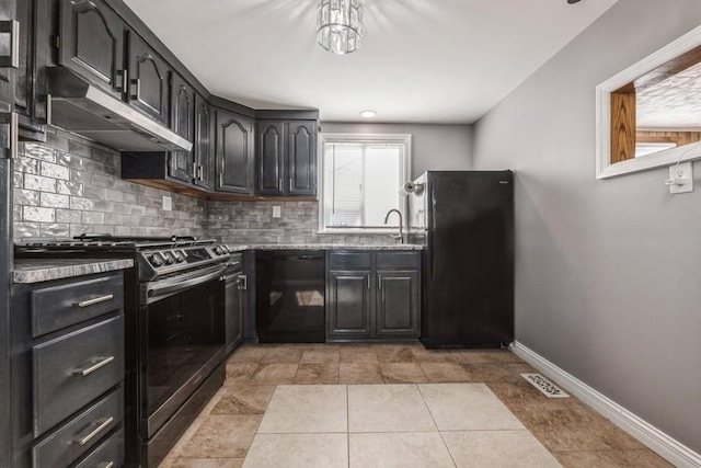 kitchen featuring sink, light tile patterned floors, decorative backsplash, and black appliances