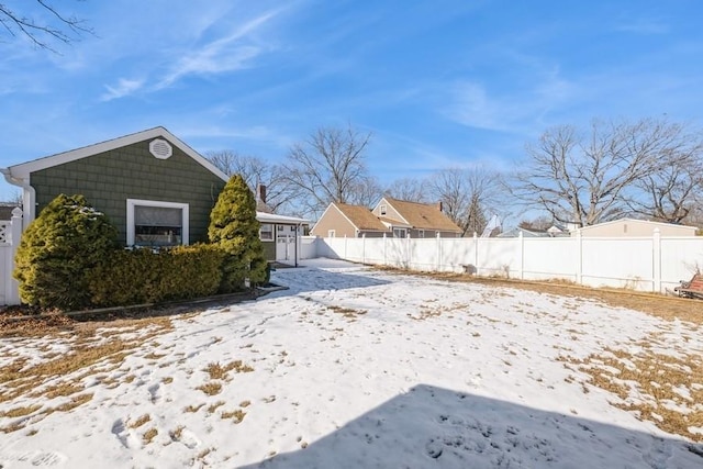 view of yard covered in snow