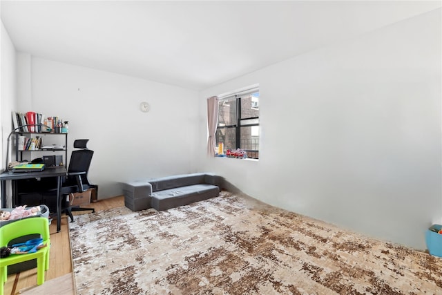 bedroom with hardwood / wood-style flooring