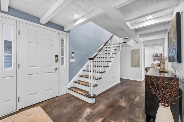 foyer featuring stairs, baseboards, dark wood finished floors, and beam ceiling