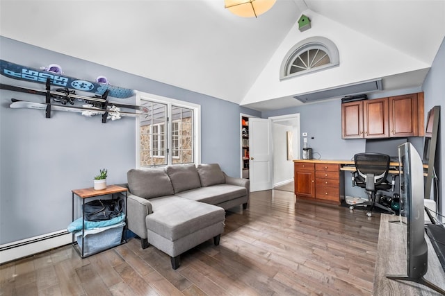 office featuring high vaulted ceiling, a baseboard radiator, built in desk, and wood finished floors