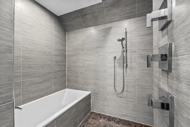 full bath featuring a tile shower