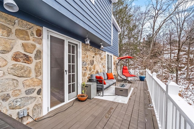 snow covered deck with outdoor lounge area