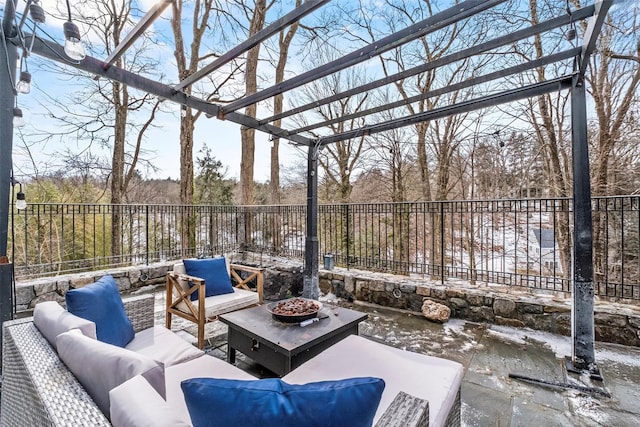 view of patio / terrace featuring an outdoor living space with a fire pit, fence, and a pergola