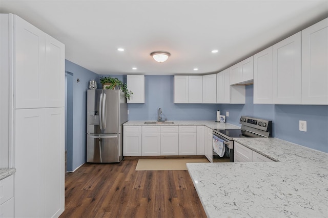 kitchen featuring sink, dark hardwood / wood-style flooring, stainless steel appliances, light stone countertops, and white cabinets