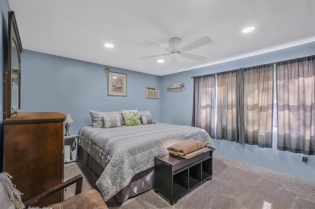 bedroom with an AC wall unit and ceiling fan