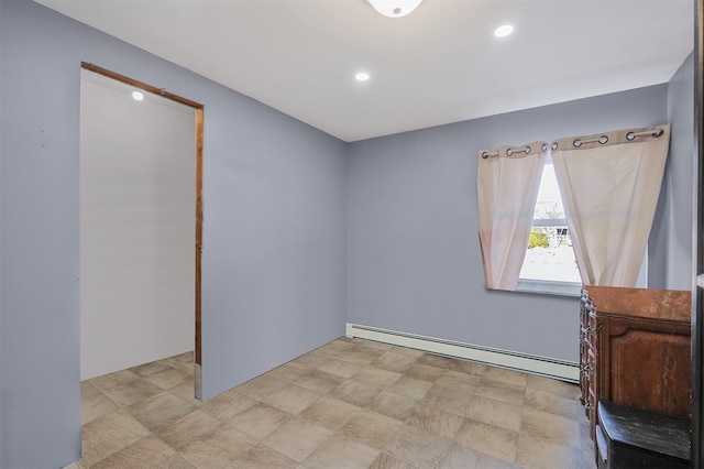 empty room featuring a baseboard heating unit