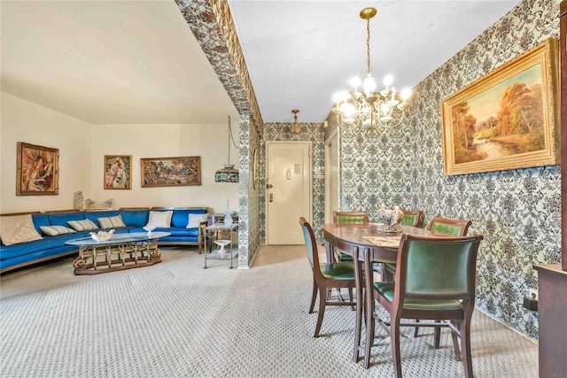 dining area featuring carpet floors and a chandelier