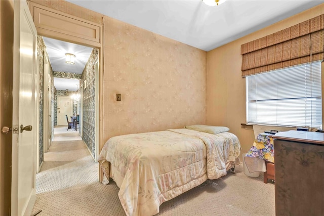 bedroom with light colored carpet