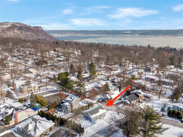 snowy aerial view with a mountain view