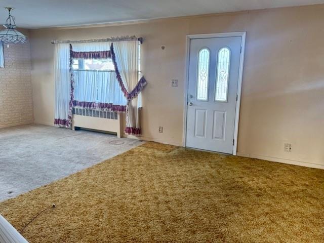 carpeted foyer with radiator