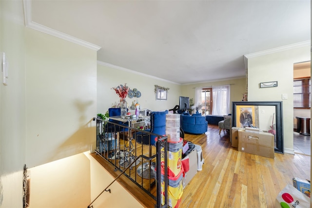 living room with light hardwood / wood-style flooring and ornamental molding