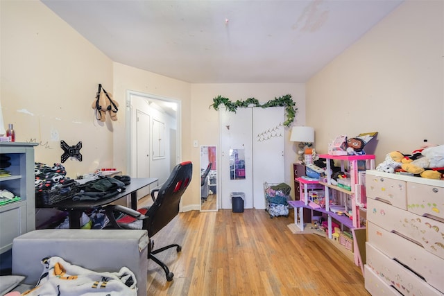 office with light hardwood / wood-style flooring