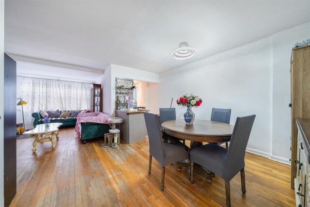 dining space with light hardwood / wood-style floors