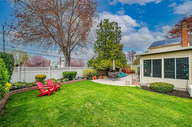 view of yard with a fenced backyard and a patio area